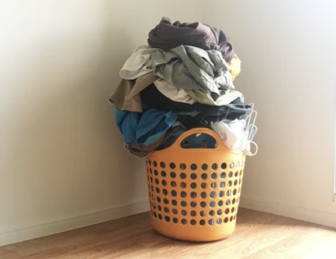 Overflowing basket of dirty laundry