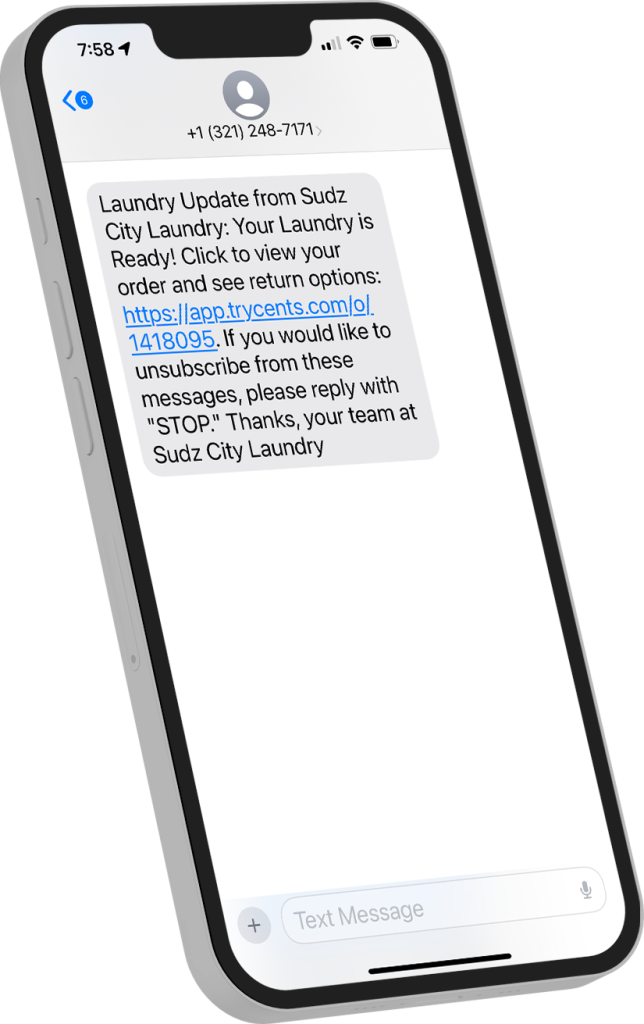 iPhone screen with a text message from sudz city notifying the user that their laundry is ready for pickup