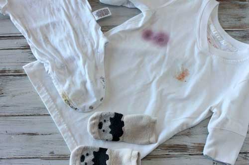 Stained laundry spread out on a table